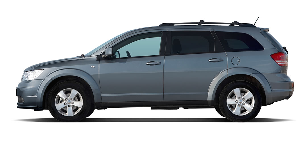 Side view of a white 4-door Honda Accord